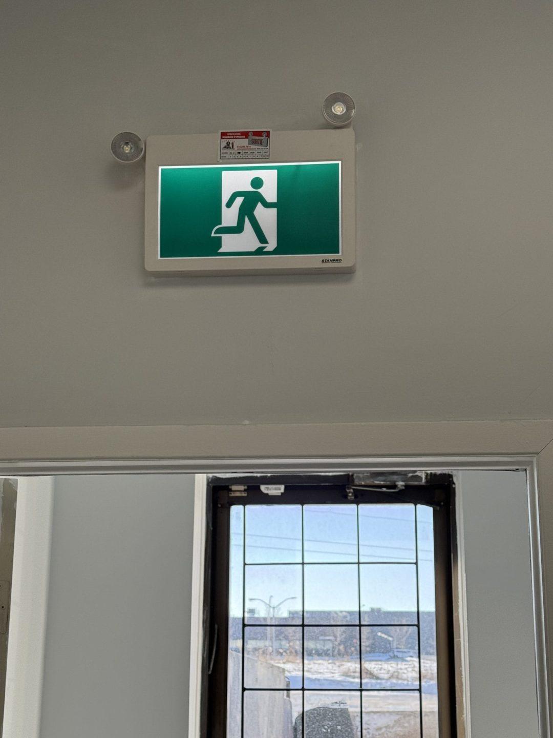 Running man exit sign above door