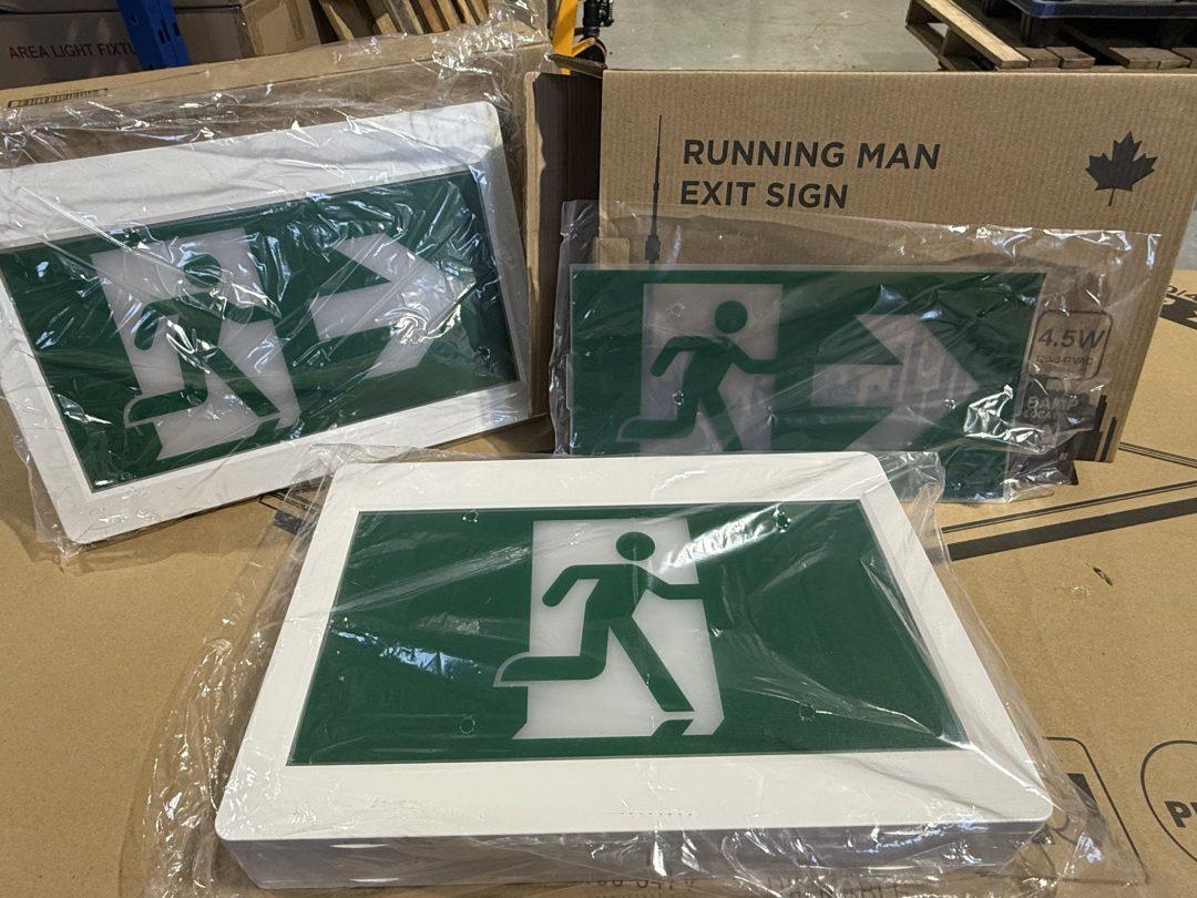 Running man exit sign on boxes