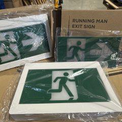 Running man exit sign on boxes